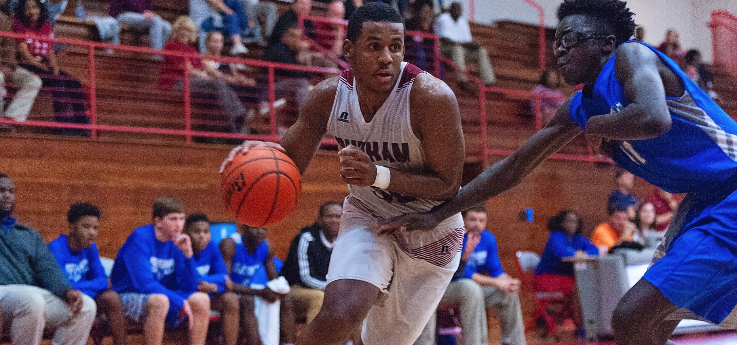 Former Dunham basketball player Jordan Wright running with basketball